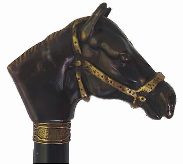 Bastón caballo con riendas, resina baño de bronce. Palo madera haya negro. Contera cónica de goma.