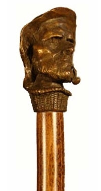 Bastón de bronce macizo "Marinero con pipa". Palo madera de haya color nogal. Contera de goma.