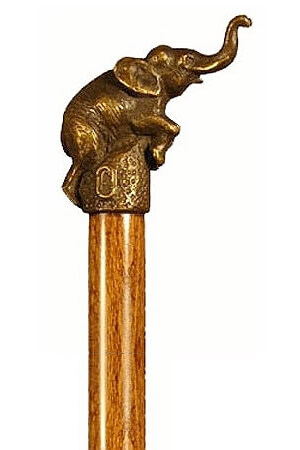Bastón de bronce macizo "Elefante". Palo madera de haya color nogal. Contera de goma.