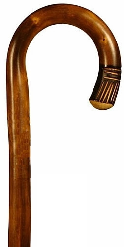 Bastón, de 1 sola pieza, curvo en madera de castaño flameado con talla. Contera goma.