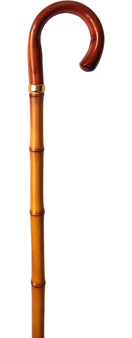 Bastón con empuñadura curva de madera. Palo caña de bambú gruesa. Contera de goma.