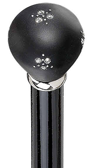 Bastón bola de acetato con revestimiento suave negro e incrustaciones símil diamantes. Contera goma.