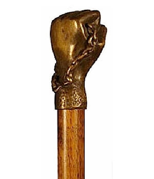 Bastón de bronce macizo "Mano". Palo madera de haya color nogal. Contera de goma.